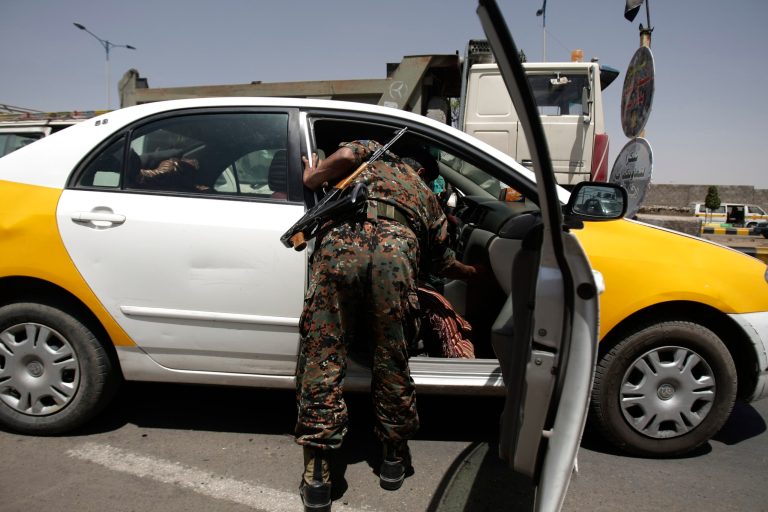A Yemeni soldier searches a car at a checkpoint in Sanaa, Yemen, Sunday, March 17, 2013. Yemeni police and army troopers are deployed in Sanaa to secure the activities of a national dialogue conference which aims to put the country on the course to full democratic elections next year. (AP Photo/Hani Mohammed)