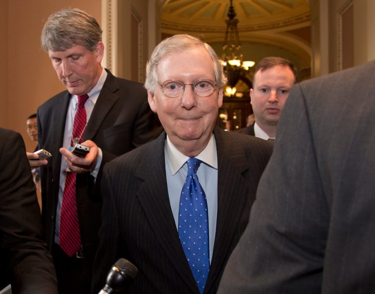 Senate Minority Leader Mitch McConnell, R-Ky., is followed by reporters after agreeing to the framework of a deal to avoid default and reopen the government. (AP Photo/Carolyn Kaster)