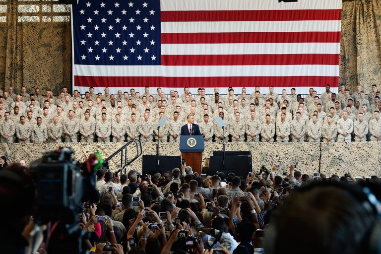 President Obama delivers remarks during his visit at Camp Pendleton Marine Corps base in Camp Pendleton, California. Two civilian defense contractors have pleaded guilty in a San Diego federal court, bringing to nine the number of defendants who have admitted guilt in recent days to their involvement in a scheme involving bribes and kickbacks at Camp Pendleton and other federal facilities. (Photo by Kevork Djansezian/Getty Images)