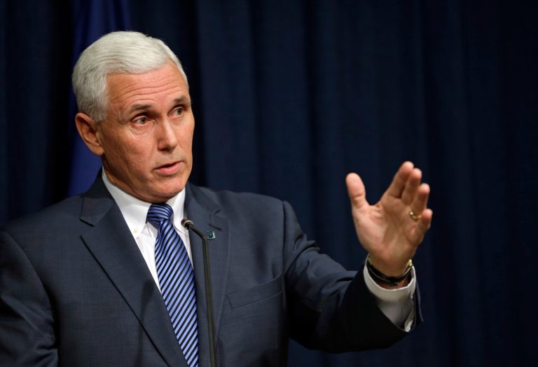 Mike Pence is on the defensive over his signing of the Religious Freedom Restoration Act. (AP Photo)