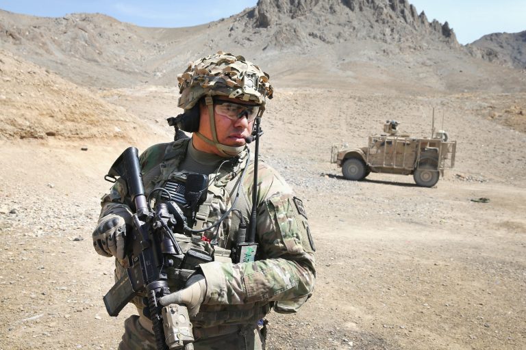 SSG Daniel Pina from Los Angeles, California with the U.S. Army's 2nd Battalion 87th Infantry Regiment, 3rd Brigade Combat Team, 10th Mountain Division patrols in the foothills outside of Forward Operating Base Shank on March 31, 2014 near Pul-e Alam, Afghanistan. (Photo by Scott Olson/Getty images)