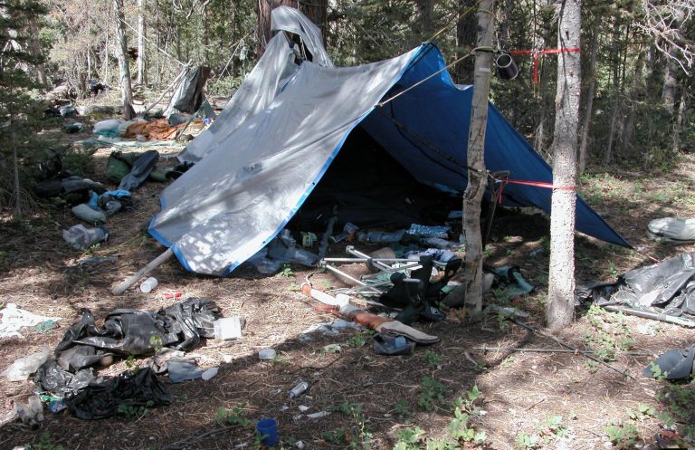 FILE - This undated file photo provided by the Iron County Sheriff's Office shows a remote camp littered with supplies and trash, believed to have been left behind by Troy James Knapp, in the southern Utah wildness near Zion National Park. Authorities say they have arrested Knapp, a survivalist suspected of burglarizing Utah cabins and evading law enforcement for years. (AP Photo/Iron County Sheriff, File)