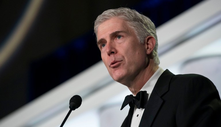 Supreme Court Associate Justice Neil Gorsuch stayed silent during oral arguments on a case that could determine the political strength of labor unions. (AP Photo/Sait Serkan Gurbuz)