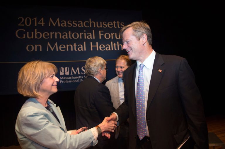 Democratic gubernatorial hopeful Martha Coakley, left, shakes hand with Republican gubernatorial hopeful Charlie Baker. (Gretchen Ertl/AP Images for Massachusetts School of Professional Psychology.)