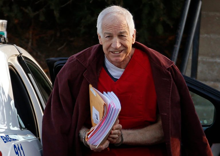 FILE - In this Jan. 10, 2013, file photo, former Penn State assistant football coach Jerry Sandusky arrives at the Centre County Courthouse for a post-sentencing hearing in Bellefonte, Pa. Penn State said Monday, Oct. 28, 2013 that it is paying $59.7 million to 26 young men over claims of child sexual abuse at the hands of Sandusky. The university said it had concluded negotiations that have lasted about a year. The school said 23 deals are fully signed and three are agreements in principle. The school faces six other claims, and the university says it believes some do not have merit while others may produce settlements. Sandusky, 69, is serving a 30- to 60-year prison sentence at a state prison in southwestern Pennsylvania. (AP Photo/Gene J. Puskar, File)