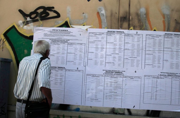   An man tries to find a polling station during the elections in Thessaloniki, Sunday, June 17, 2012. Greeks voted Sunday for the second time in six weeks in what was arguably their country's most critical election in 40 years, with the country's treasured place within the European Union's joint currency in the balance. (AP Photo/Dimitri Messinis)  