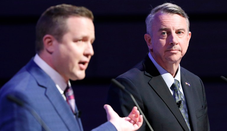 Republican gubernatorial candidate, Ed Gillespie, right, listens as Corey Stewart, left, gestures during a debate at Liberty University in Lynchburg, Va., Thursday, April 13, 2017. (AP Photo/Steve Helber)'