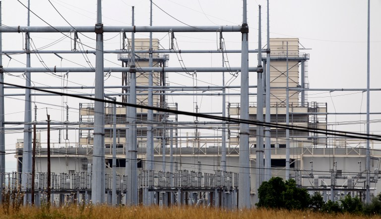 This 2010 photo shows part of the Pepco power generating station in Dickerson, Md., 30 miles north of Washington, D.C. Pepco Holdings, which provides electricity in the nation's capital and Maryland, announced discounts Tuesday for 296,000 and 770,000 residents respectively after the passage of the tax reform bill. (AP Photo/J. Scott Applewhite)