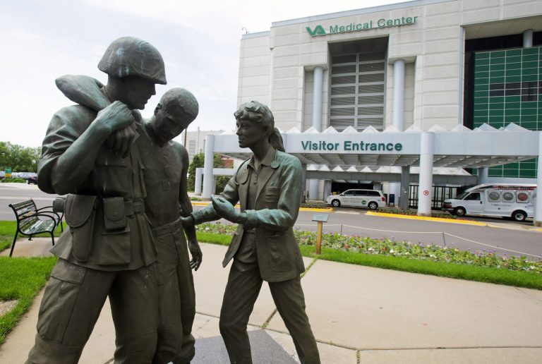 Three statues portraying a wounded soldier being helped, stand on the grounds of the Minneapolis VA Hospital.Â The VA's problems don't stem from who happens to be in charge; they're systemic and deep-rooted. (AP Photo/Jim Mone)
