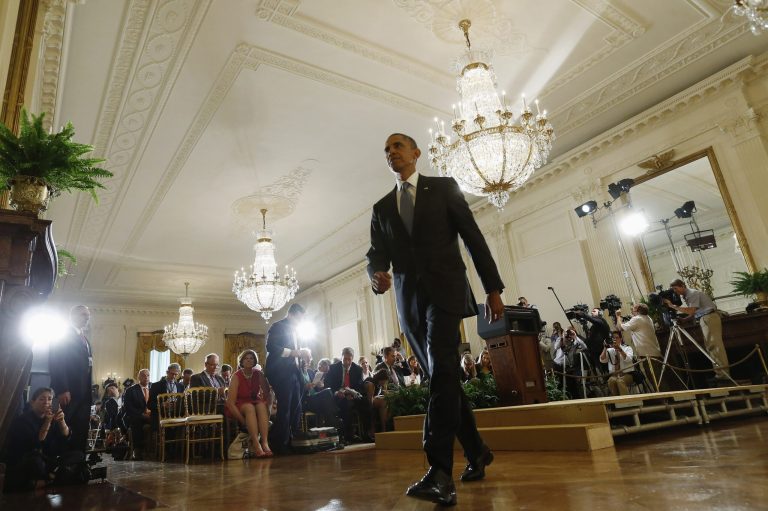   President Barack Obama leaves after his news conference in the East Room at the White House in Washington, Friday, Aug. 9, 2013. The president said he'll work with Congress to change the oversight of some of the National Security Agency's controversial surveillance programs and name a new panel of outside experts to review technologies. (AP Photo/Charles Dharapak)  