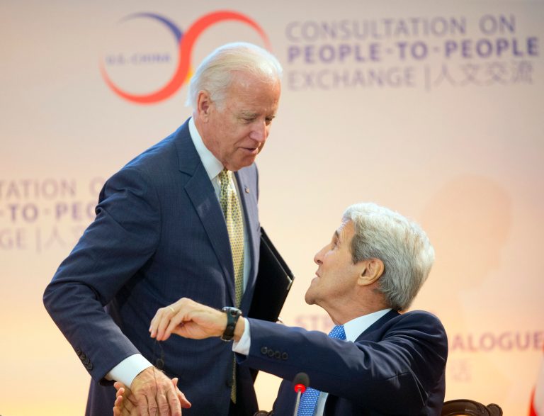 Potential Clinton replacements? Vice President Joe Biden, left, shakes hands with Secretary of State John Kerry, right seated, after speaking at the State Department last June. (AP Photo/Pablo Martinez Monsivais)