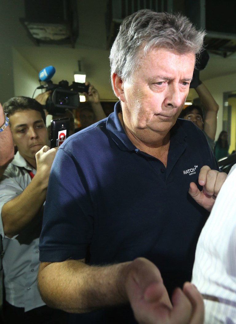 Ray Whelan, a longstanding director and project manager within the MATCH group, arrives at a police station after been arrested, in Rio de Janeiro, Brazil, Monday, July 7, 2014.  Whelan, a senior executive with the official World Cup corporate hospitality provider was arrested Monday in the plush beachside hotel, as part of a Brazilian police investigation into illegal ticket sales. (AP Photo/STR)