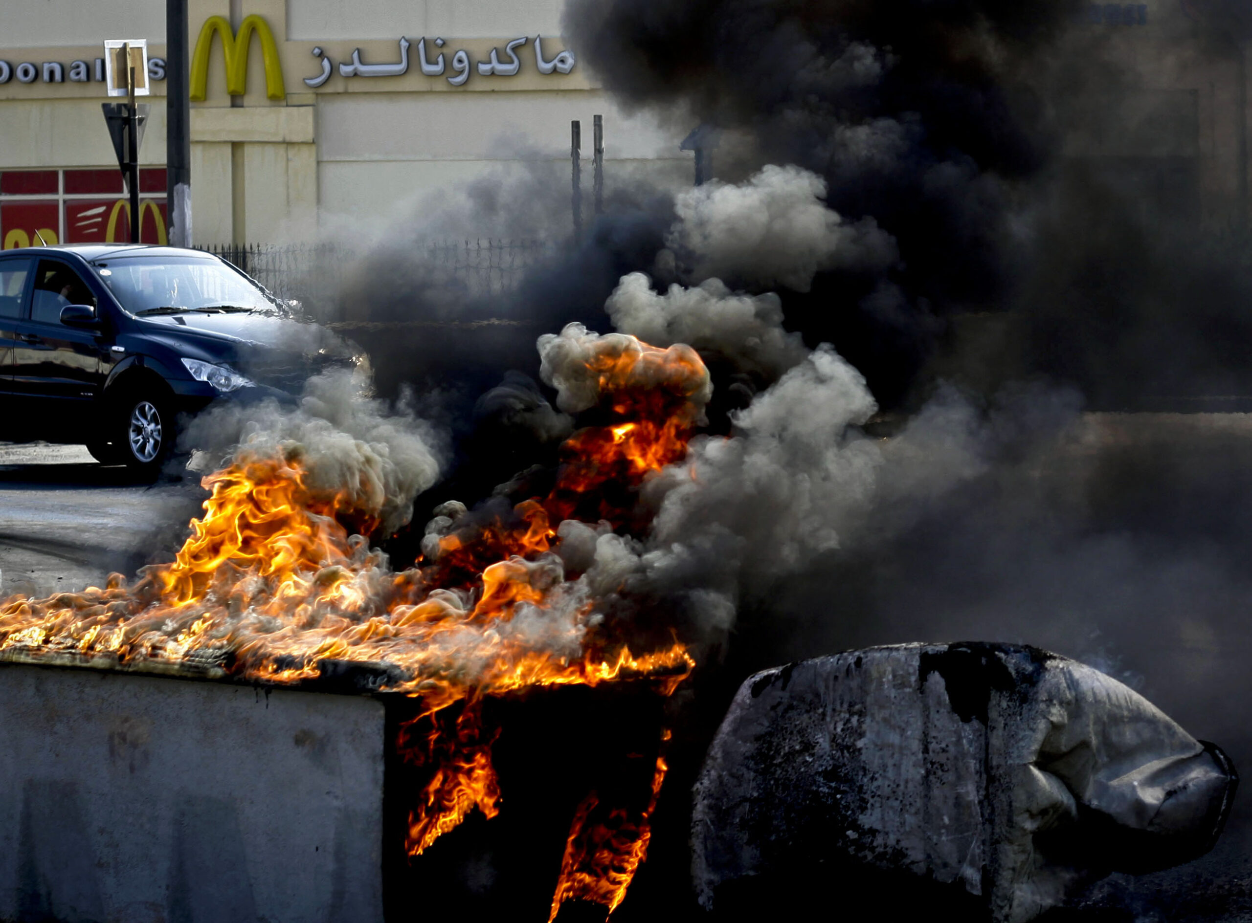 Bahrain protesters challenge police in capital