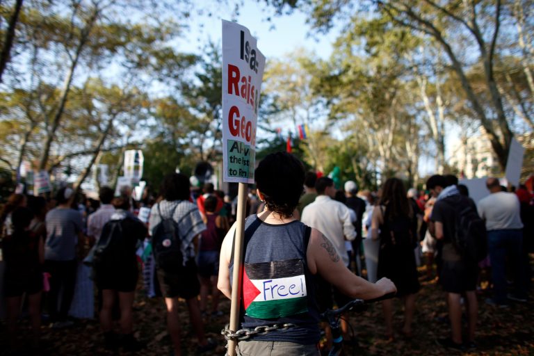 Demonstrators gather in Brooklyn's Cadman Plaza Park as they prepare to march across the Brooklyn Bridge during a pro-Palestinian rally, Wednesday, Aug. 20, 2014, in New York. (AP Photo/Jason DeCrow)