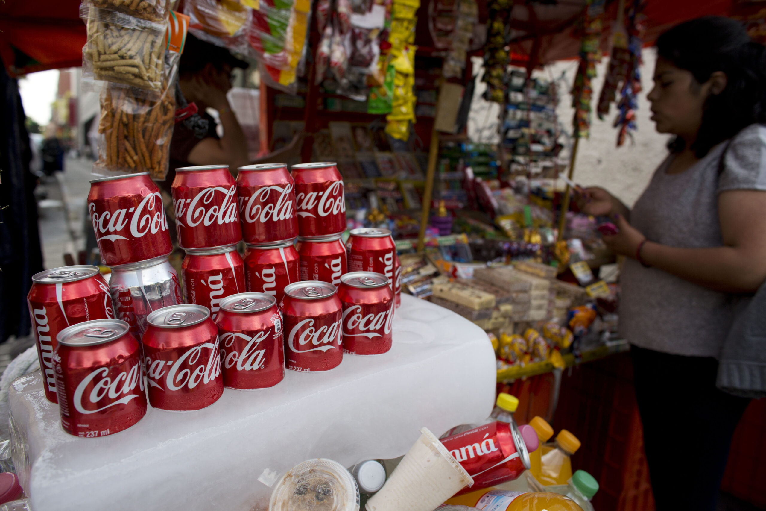 Coke to slash costs as soda sales remain flat