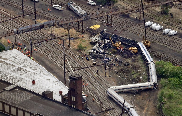 In this aerial photo, emergency personnel work at the scene of a passenger train wreck in Philadelphia on Wednesday, May 13, 2015. (AP Photo/Patrick Semansky)