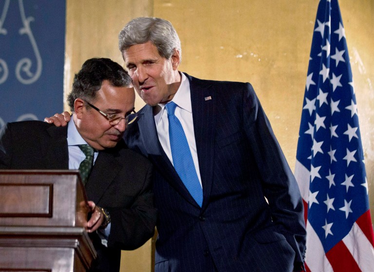 U.S. Secretary of State John Kerry, right, speaks with Egypt's Foreign Minister Nabil Fahmy during a joint press conference in Cairo, Sunday, Nov. 3, 2013. Kerry is in Cairo pressing for reforms during the highest-level American visit to Egypt since the ouster of the country's first democratically elected president. The Egyptian military's removal of Mohammed Morsi in July led the U.S. to suspend hundreds of millions of dollars in aid. This is the first stop in an 11-day trip that will take Kerry to the Mideast and Europe. (AP Photo/Jason Reed, Pool)