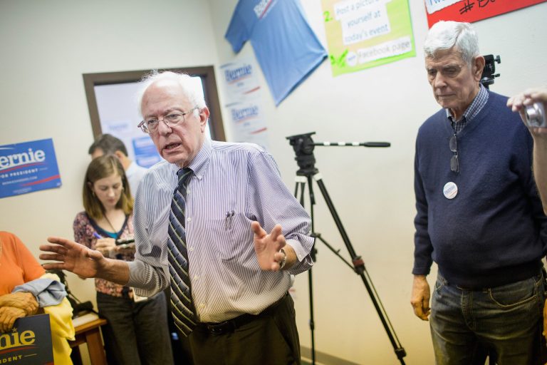 Democratic presidential candidate Sen. Bernie Sanders, I-Vt., chats with supporters during a visit to his Iowa campaign headquarters on June 13, 2015 in Des Moines, Iowa. (Photo by Scott Olson/Getty Images)