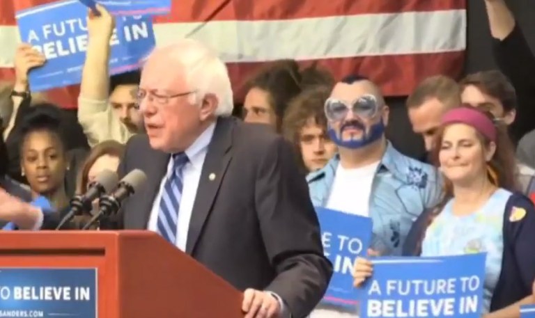 Man With Blue Beard Blows Kisses At Bernie