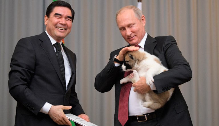 Turkmenistan's President Gurbanguly Berdymukhamedov, right, smiles as he presents a puppy to Russian President Vladimir Putin during their meeting in the Bocharov Ruchei residence in the Black Sea resort of Sochi, Russia, Wednesday, Oct. 11, 2017. The presidents met on the sidelines of a summit of leaders of ex-Soviet nations in Sochi. (Alexei Druzhinin/Sputnik, Kremlin Pool Photo via AP)