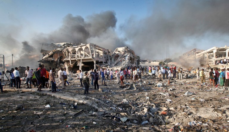 Somalis gather and search for survivors by destroyed buildings at the scene of a huge explosion. Several Islamic State militants were killed in two U.S. airstrikes in northeastern Somalia. (AP Photo/Farah Abdi Warsameh, File)