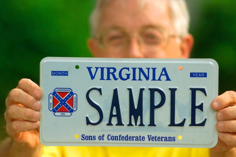 Brag Bowling, First Lieutenant Commander Of The Sons Of Confederate Veterans Virginia Division, Holds A Sample Virginia Licence Plate Containing His Organization's Logo, Which Incorporates The Confederate Battle Flag, May 8, 2002 In Richmond, Va. (Photo By Wayne Scarberry/Getty Images)
