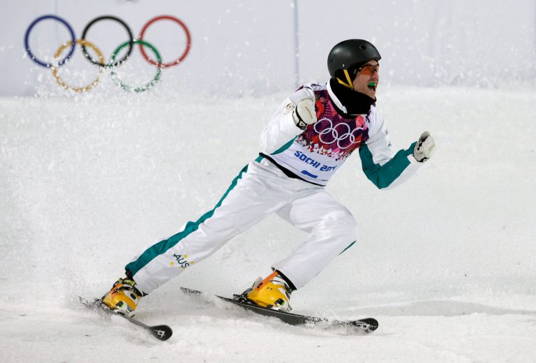 Silver medal winner David Morris of Australia celebrates after his final jump during men's freestyle skiing aerials at the Rosa Khutor Extreme Park, at the 2014 Winter Olympics, Monday, Feb. 17, 2014, in Krasnaya Polyana, Russia. (AP Photo/Andy Wong)
