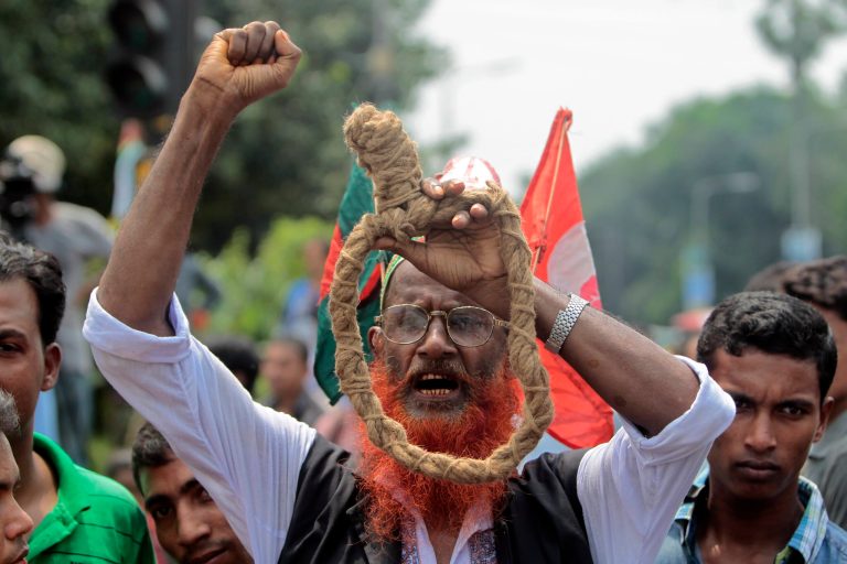 A Bangladeshi campaigner for capital punishment for all war crime suspects involved in the 1971 war of independence holds a noose during a protest against a court ruling commuting the death sentence of Jamaat-e-Islami leader Delwar Hossain Sayedee, in Dhaka, Bangladesh, Wednesday, Sept. 17, 2014. Sayedee must remain in prison 