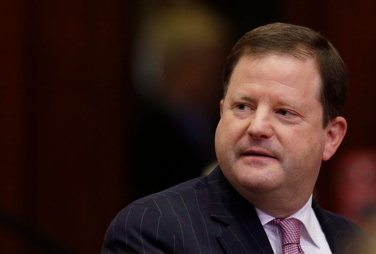 Connecticut state Senate Minority Leader and gubernatorial hopeful John McKinney, R-Fairfield, enters the House Chamber before Gov. Dannel P. Malloy delivers his 2014 State of the State address in front of a joint session of the legislature in the House Chambers at the Capitol in Hartford, Conn., Thursday, Feb. 6, 2014. (AP Photo/Stephan Savoia)