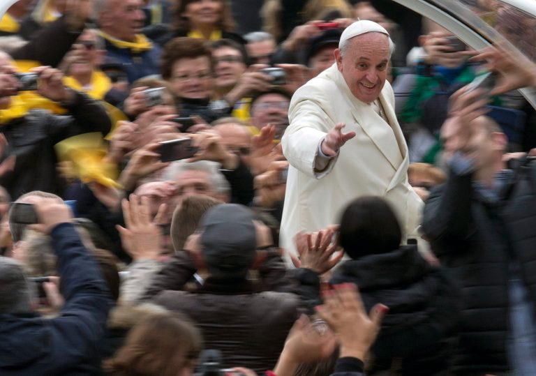 Pope Francis waves to faithful from his pope-mobile as he arrives for his weekly general audience in St. Peter's Square at the Vatican, Wednesday, Jan. 22, 2014. (AP Photo/Alessandra Tarantino)