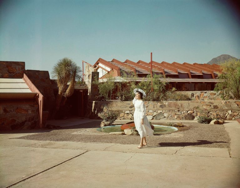 FILE - In this May 9, 1960 file photo, Mrs. Olgivanna Wright, wife of architect Frank Lloyd Wright, stands one of the architecture school buildings at Taliesen West, at Scottsdale, Ariz. The Frank Lloyd Wright School of Architecture's quest for a way to keep its accreditation status has some school board members at odds with the foundation operating it. Last week, the Scottsdale-based Frank Lloyd Wright Foundation announced it would not spin off the school into an independent corporation as a way to abide by new standards to gain accreditation. That decision has shaken the school's Board of Governors, who say that could mean the program would eventually become a shell of itself.  (AP Photo)