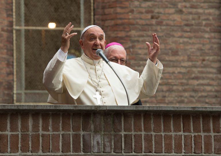 In this pool photo taken Sunday, June 21, 2015, and made available Monday, June 22, Pope Francis salutes upon arrival at the hospital Cottolengo of Turin, northern Italy, Sunday, June 21, 2015. (L' Osservatore Romano/Pool Photo via AP)