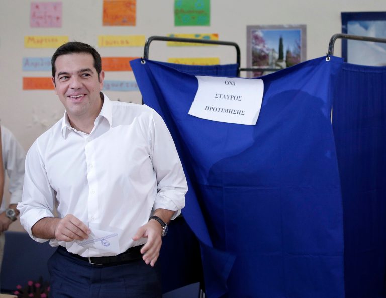 Leader of left-wing Syriza party and former Prime Minister Alexis Tsipras casts his vote at a polling station in Athens, Sunday, Sept. 20, 2015. (AP Photo/Lefteris Pitarakis)