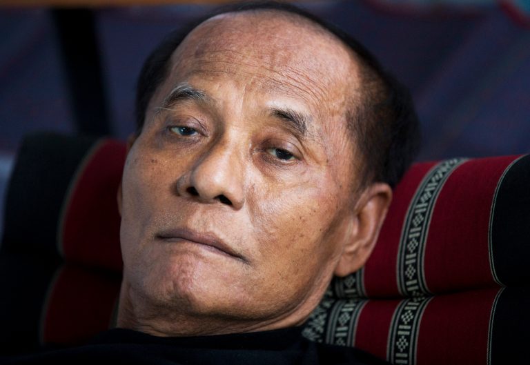 In this photo taken June 13, 2014, Chalad Worachat lies on the ground during a hunger strike outside the Parliament in Bangkok, Thailand. Over the past decades, Chalad has resisted military regimes and dictatorial legislation by staging hunger strikes, five of them. Now the 71-year-old onetime parliamentarian is back on water and honey, despondent that after so many years and so much bloodshed, Thailand has been unable to break out of a vicious cycle of military coups to achieve true democracy. (AP Photo/Sakchai Lalit)