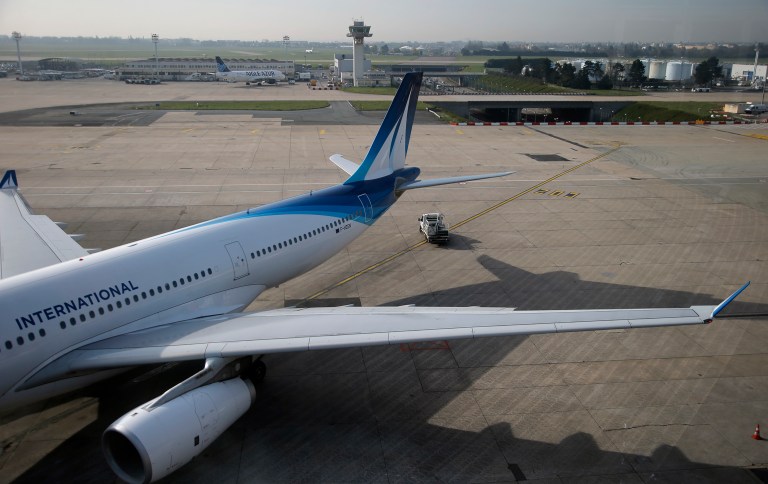 FILE - In this April 8, 2015 file photo, a plane parks on the tarmac at Paris Orly airport, south of Paris. French police say a man was shot to death after trying to seize the weapon of a soldier guarding Paris' Orly Airport, Saturday March 18, 2017. (AP Photo/Francois Mori, File)