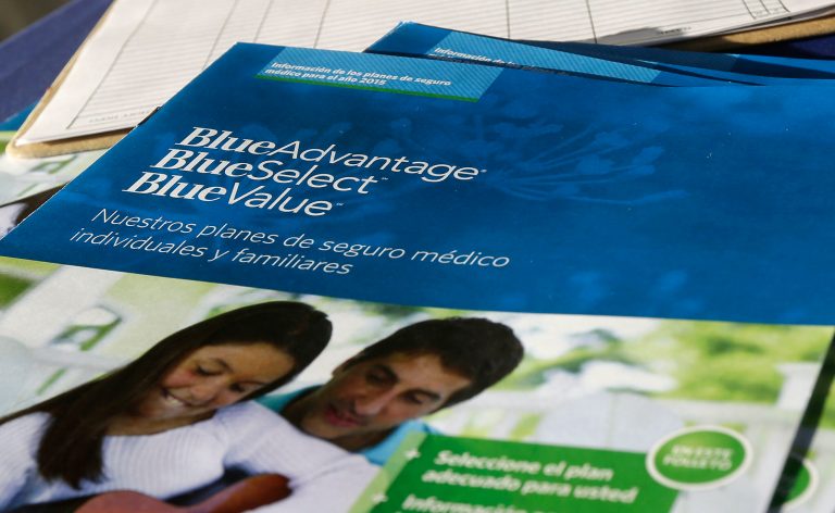 Flyers promoting Blue Cross Blue Shield and Obamacare.Â (AP Photo)