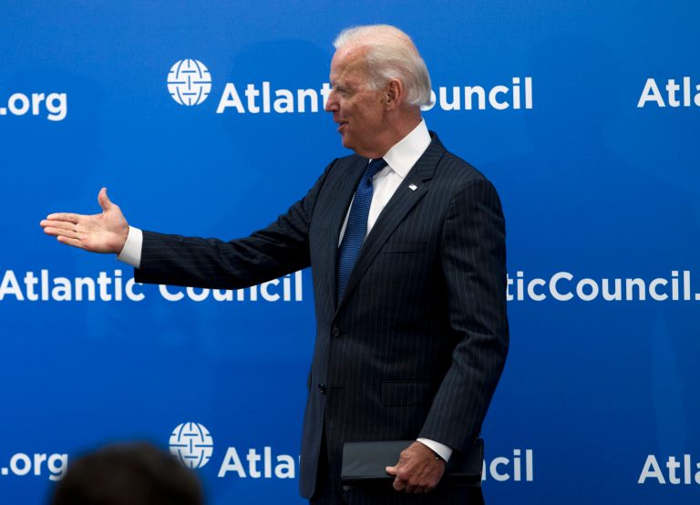 Vice President Joe Biden gestures as he arrives to speak at the Atlantic Council's conference, in a special tribute to NATO and the European Union, Wednesday, April 30, 2014, in Washington. Biden drew parallels between Russia's interference in Ukraine and the world wars of the last century. Biden said Ukraine's struggles start with Russia's acute violation of rules that the 20th century taught us must be upheld. He says Russia has violated the fundamental principle that Europe's borders cannot be changed by military force. (AP Photo/Jose Luis Magana)