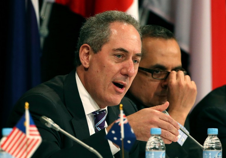 Mike Froman of the U.S. gestures as he speaks during a press conference at the Trans-Pacific Partnership meeting in Sydney, Australia, Monday, Oct. 27, 2014. (AP Photo/Rob Griffith)