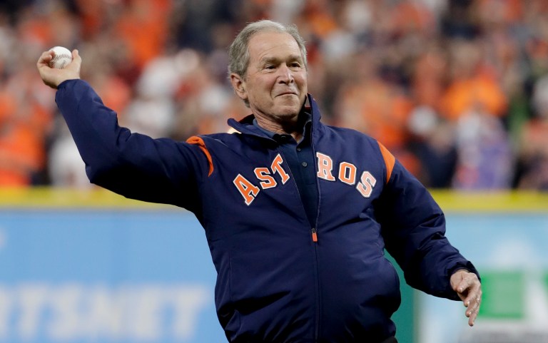 Former President George W. Bush throws the ceremonial first pitch before Game 5 of baseball's World Series between the Houston Astros and the Los Angeles Dodgers Sunday, Oct. 29, 2017, in Houston. (AP Photo/Matt Slocum)