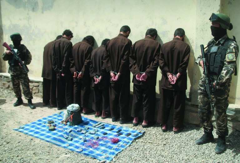 Seven suspected Taliban insurgents are shown to the media in Herat, west of Kabul, Afghanistan, Wednesday, June 20, 2012. Afghan intelligence security forces arrested seven suspected Taliban insurgents on Tuesday with their explosive materials during an operation.(AP Photo/Hoshang Hashimi)