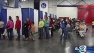 Attendees wait in lines for information at a healthcare forum inside Houston's George R. Brown Convention Center . (WTRK photo)