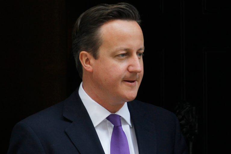   British Prime Minister David Cameron leaves 10 Downing Street in London, Thursday, June 14, 2012. Cameron is due to give evidence at the Leveson Inquiry, a judge-led inquiry into media ethics, at the High Court in London on Thursday. (AP Photo/Sang Tan)  