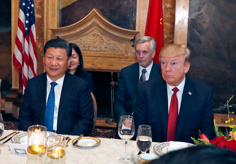 President Donald Trump and Chinese President Xi Jinping seated during a dinner at Mar-a-Lago. Trump told Xi about the missile strike on Syria over 