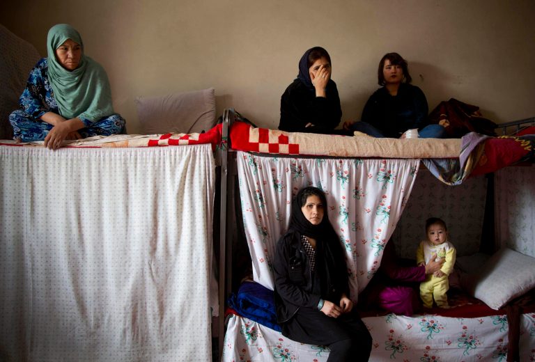 FILE - This picture taken March 28, 2013 shows Afghan female prisoner in their cell at Badam Bagh, Afghanistan's central women's prison, in Kabul, Afghanistan. Conservative religious lawmakers in Afghanistan blocked a law on Saturday, May 18, 2013 that aims to protect women's freedoms, with some arguing that parts of it violate Islamic principles or encourage women to have sex outside of marriage.(AP Photo/Anja Niedringhaus, File)