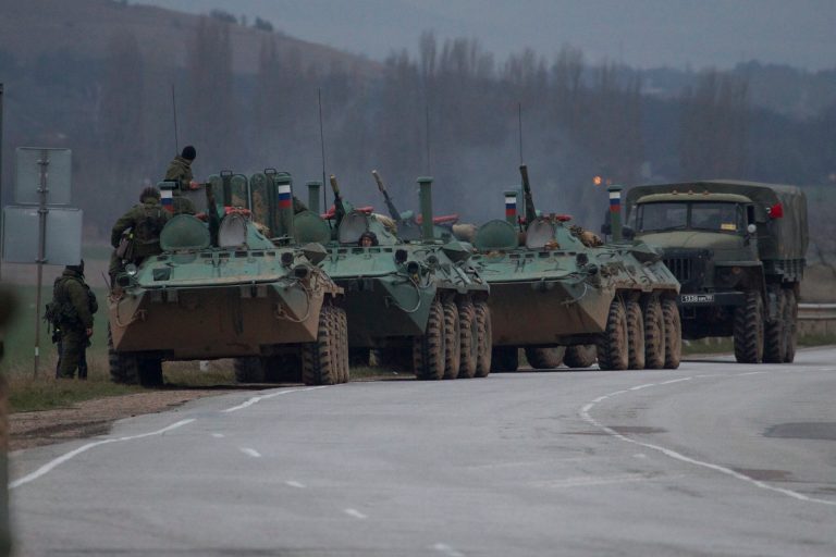 Russian armored personnel carriers and a truck are parked on the side of the road near the town of Bakhchisarai, Ukraine, Friday. (AP Photo/Ivan Sekretarev)