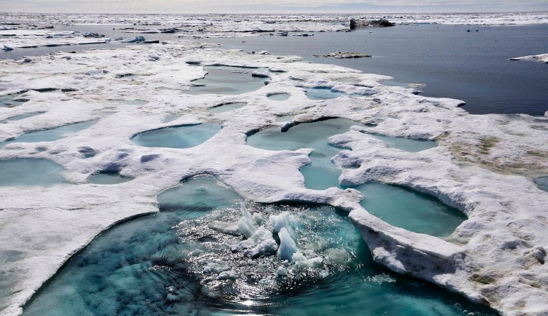 Ice is broken up by the passing of the Finnish icebreaker MSV Nordica as it sails through the Beaufort Sea off the coast of Alaska while traversing the Arctic's Northwest Passage, Sunday, July 16, 2017. The region has become a magnet for nations wanting to exploit the Arctic's rich oil reserves and other natural resources and for scientists seeking to understand global warming and its impacts on the sea and wildlife. (AP Photo/David Goldman)