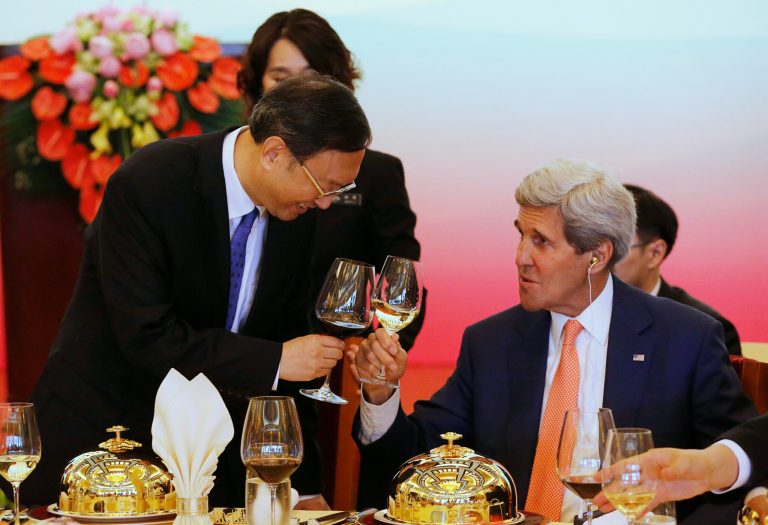 China's State Councillor Yang Jiechi, left, shares a toast with U.S. Secretary of State John Kerry before a working lunch at the U.S.-China Strategic and Economic Dialogue, at the Diaoyutai State Guesthouse in Beijing Wednesday, July 9, 2014. (AP Photo/Jim Bourg, Pool)