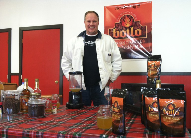   In this Dec. 12, 2012 photo Chris Brokenshire poses with his creation, a drink mix based on a traditional Pennsylvania coal-region cocktail called boilo, in Ringtown, Pa. Brokenshire is trying to commercialize the drink, which has been around for at least a century and is typically consumed around the holidays. (AP Photo/Michael Rubinkam)  