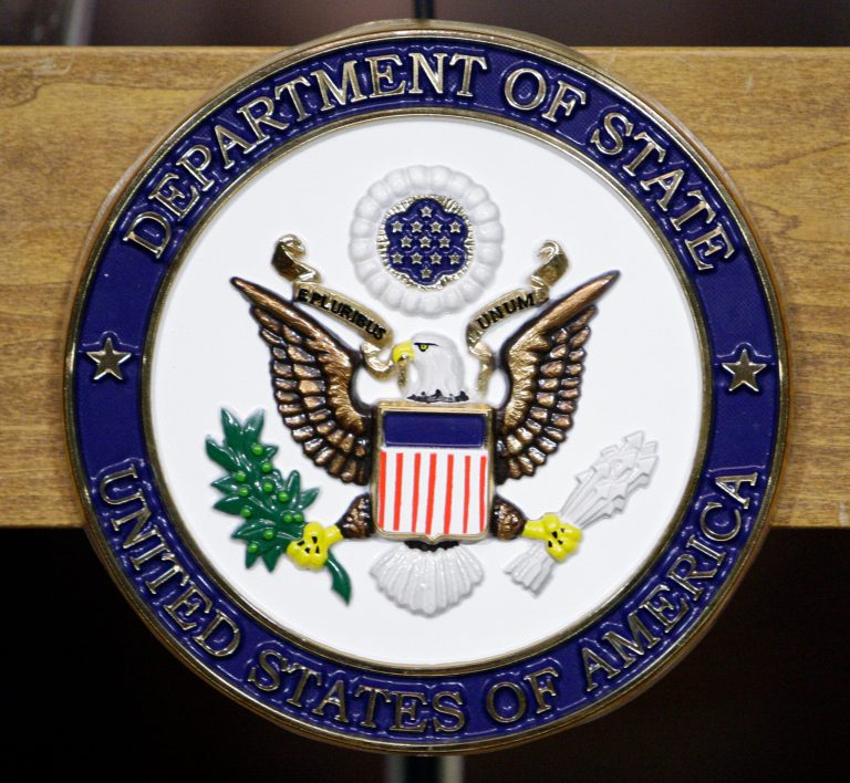The seal of the State Department.Â An attorney, formerly of Williams & Connolly, departed the Internal Revenue Service last year for the State Department, where she assumed responsibility for the release of Clinton's emails.Â (AP Photo/Alex Brandon)