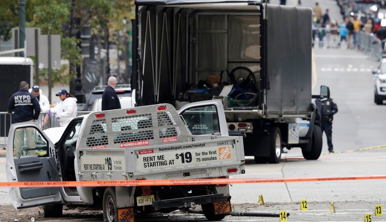 A damaged Home Depot truck remains on the scene Wednesday, after the driver mowed down people on a riverfront bike path near the World Trade Center on Tuesday in New York. (AP Photo/Mark Lennihan)
